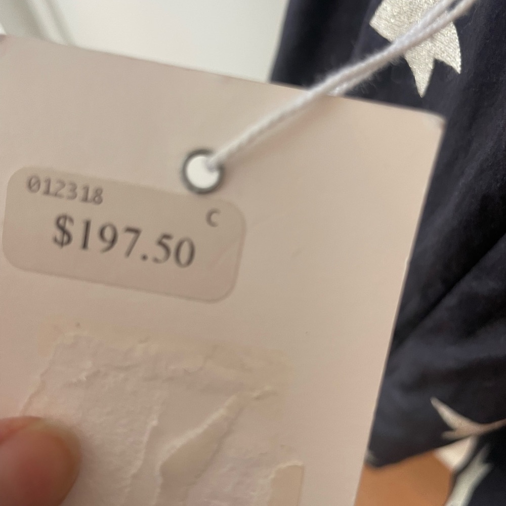 Flowy top with structured bust and ruched sleeves.